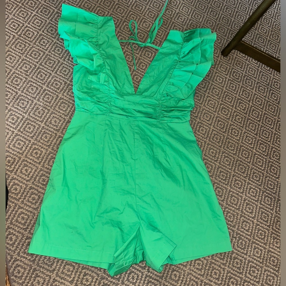 I Just Have To Have It green romper size medium. Brand new with tags